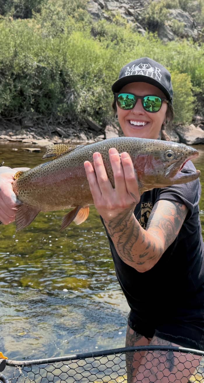Close-up of angler holding a cutthroat trout
